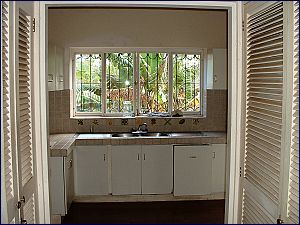 Kichen - Stove on the left and refrigerator on the right